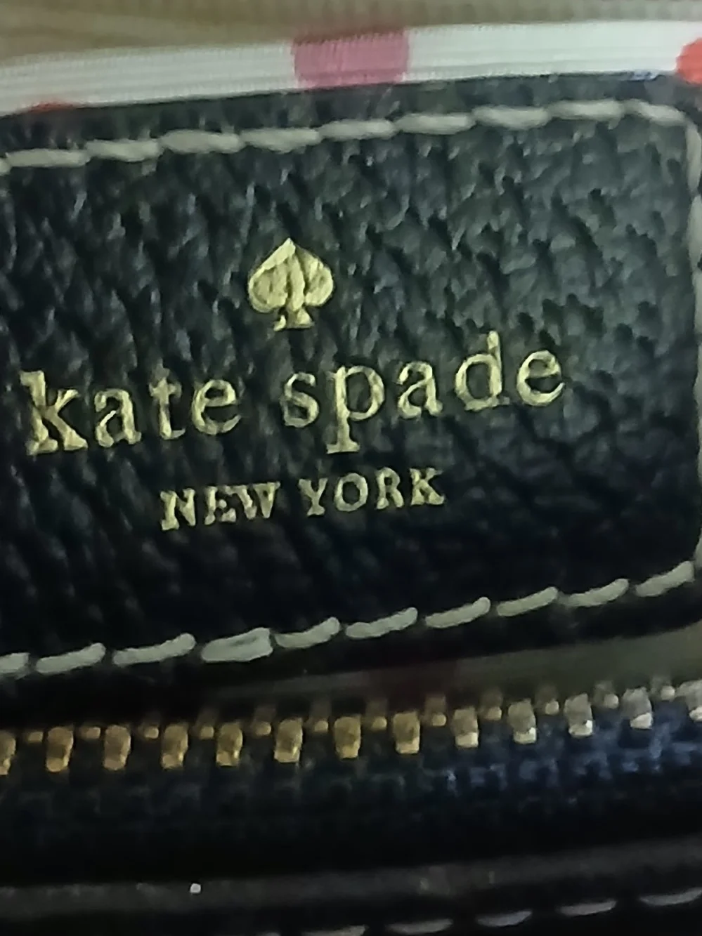 kate spade black leather satchel with polka-dot interior